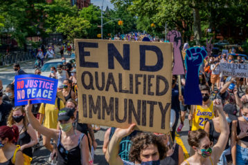 End qualified immunity protest sign
