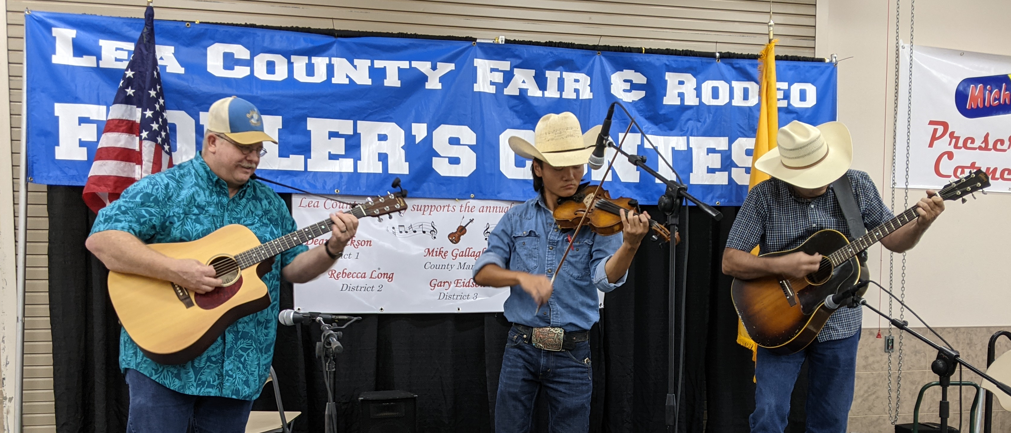 Fiddle player with two accompanists during Lea County Fair & Rodeo Fiddler's Contest in 2021