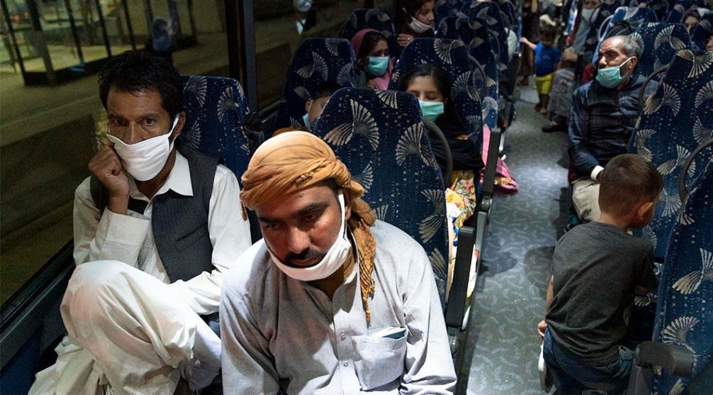 Afghan refugees on bus