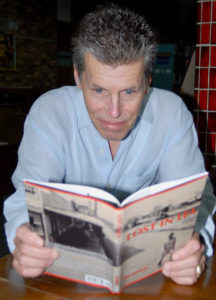 Peter Mladinic reading a book