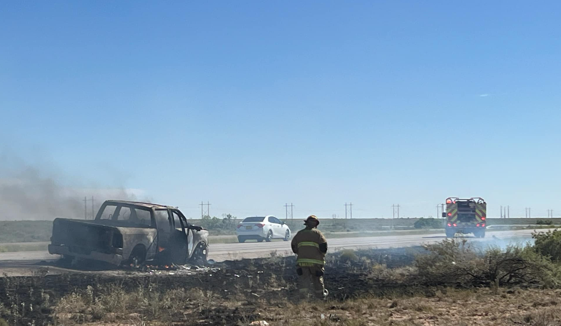 Firefighters responding to grass fire